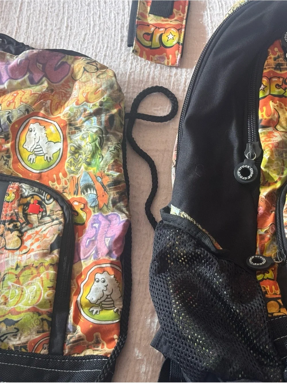 (2) CROCS Graffiti Backpack in Orange, Green, Yellow, Purple